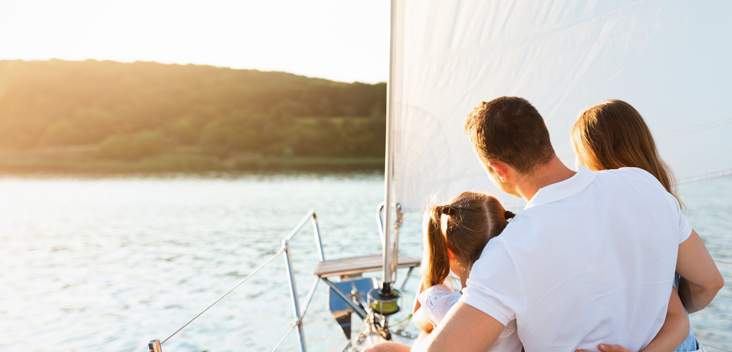Weekend On Yacht. Family Embracing Enjoying Sailboat Tour Sitting On Deck Sailing In Sea. Rear View, Copy Space